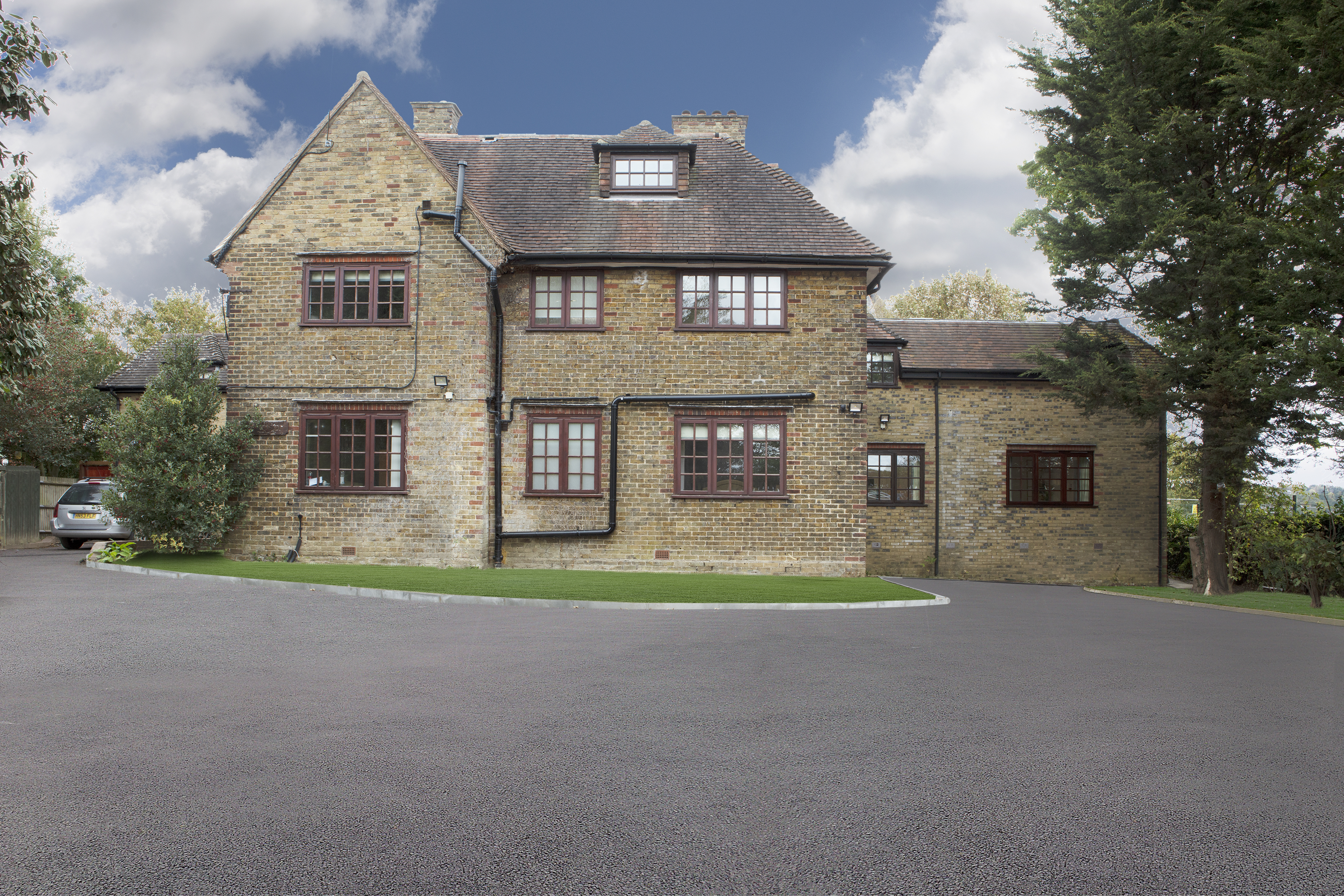 Eden House Building Exterior Image of the exterior of Eden House, a large brick building with driveway