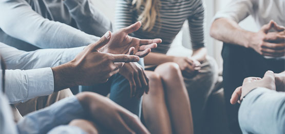Close-up-of-hands-in-group-counselling-session ISTOCK.jpg